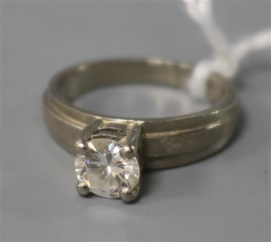An 18ct gold and solitaire diamond ring, size M.